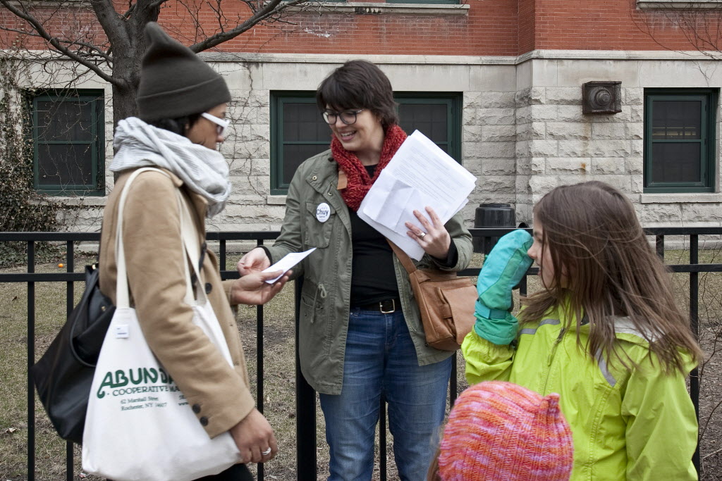 Cassie Creswell of More Than a Score passed out fliers on the PARCC test outside Otis Elementary School on Thursday