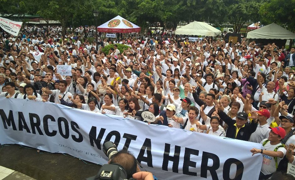 Hundreds of Filipinos rally to protest President Rodrigo Dutere's approval of a hero's burial for dictator Ferdinand Marcos. Image via @betheenaunite on Twitter