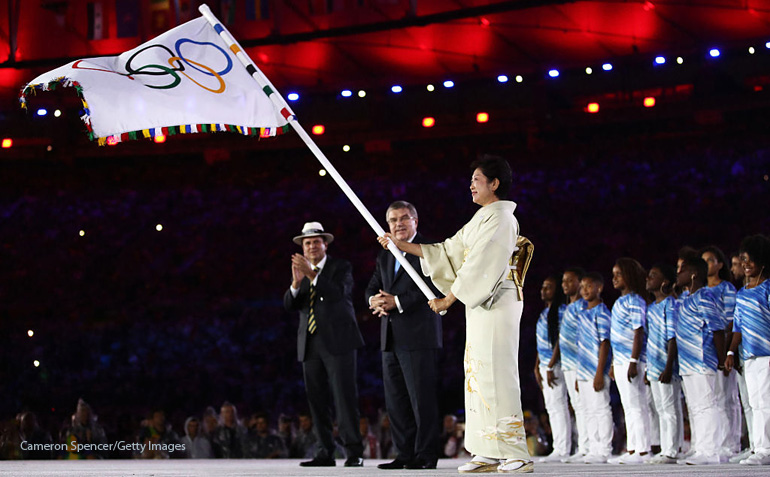 RIO DE JANEIRO BRAZIL- AUGUST 21  Mayor of Rio de Janeiro Eduardo Paes IOC President Thomas Bach and Governor of Tokyo Yuriko Koike take part in the Flag Handover Ceremony during the Closing Ceremony on Day 16 of the Rio 2016 Olympic Games at Mar