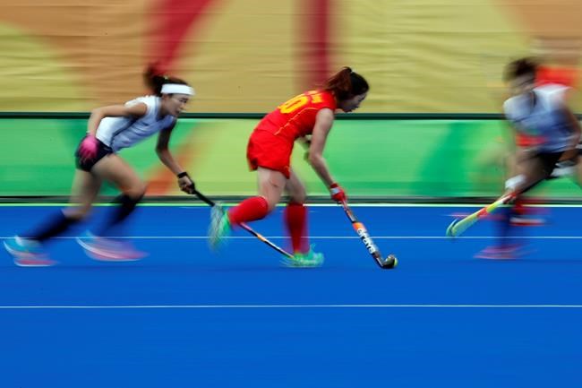 China's Yang Peng center tries to run past South Korea's defense during a women's field hockey match at the 2016 Summer Olympics in Rio de Janeiro Brazil Friday Aug. 12 2016