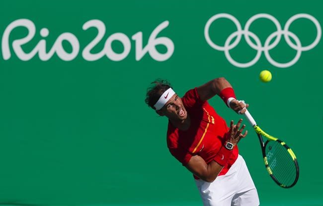 Spain's Rafael Nadal serves to Japan's Kei Nishikori during the bronze medal match of the men's tennis competition at the 2016 Summer Olympics in Rio de Janeiro Brazil Sunday Aug. 14 2016