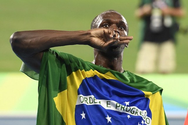 Jamaica's Usain Bolt celebrates his team's victory at the end of the Men's 4x100m Relay Final during the athletics event at the Rio 2016 Olympic Games at the Olympic Stadium in Rio de Janeiro