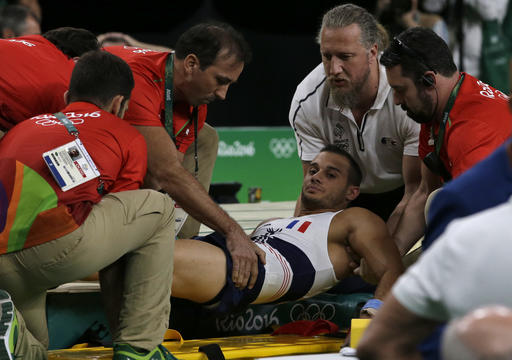 France's Samir Ait Said is assisted after injuring his leg in the vault during the artistic gymnastics men's qualification at the 2016 Summer Olympics in Rio de Janeiro Brazil Saturday Aug. 6 2016