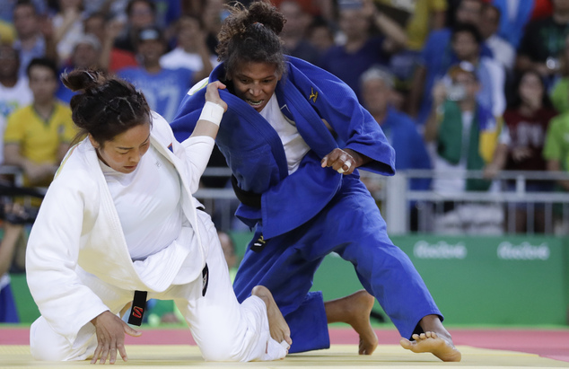 Brazil's Rafaela Silva right competes with Mongolia's Sumiya Dorjsuren for the gold medal of the women's 57-kg jud