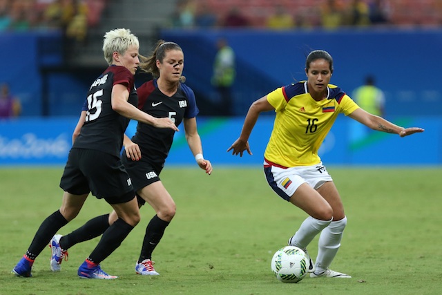 Colombia's Lady Andrade right dribbles the ball past United States&#39 Megan Rapinoe left and Kelley O'Hara during their group G match of the women's Olympic football tournament at the Arena Amazonia stadium in Manaus Brazil Tuesday Aug