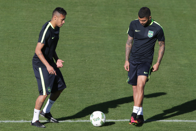 Brazil's Neymar left and Gabriel Barbosa play the ball during a Brazil Olympic soccer team training session in Brasilia Brazil Tuesday Aug. 2 2016. B