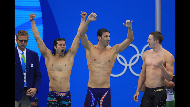 RIO DE JANEIRO BRAZIL- AUGUST 13 Ryan Murphy Michael Phelps and Cody Miller of the United States celebrate winning gold in the Men's 4 x 100m Medley Relay Final on Day 8 of the Rio 2016 Olympic Games at the Olympic Aquatics Stadium