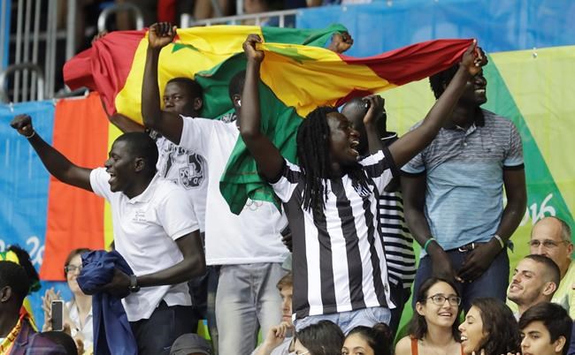 Senegal fans cheer during the second half of a women's basketball game against the United States at the Youth Center at the 2016 Summer Olympics in Rio de Janeiro Brazil Sunday Aug. 7 2016. The United States defeated Senegal 121-56. (AP