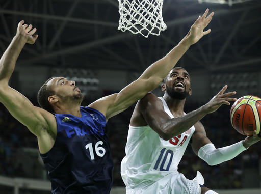 United States Kyrie Irving drives to the basket past France's Rudy Gobert during a basketball game at the 2016 Summer Olympics in Rio de Janeiro Brazil Sunday Aug. 14 2016