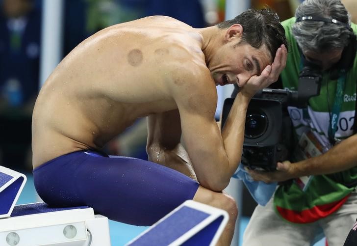 2016 Rio Olympics- Swimming- Final- Men's 4 x 200m Freestyle Relay Final- Olympic Aquatics Stadium- Rio de Janeiro Brazil- 09/08/2016. Michael Phelps of USA reacts after his team won the gold medal. REUTERS  Stefan Wermuth