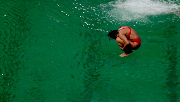 A diver takes part in a training session after the water in the diving pool turned green in the Maria Lenk Aquatic Center at the 2016 Summer Olympics in Rio de Janeiro Brazil Wednesday Aug. 10 2016. | AP