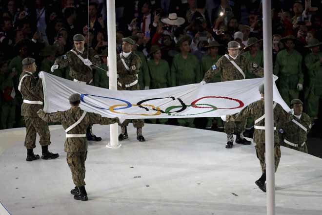 Police shot a mugger near the stadium where the Rio Olympics opening ceremony took place and a woman was killed close to another Olympic site police said Saturday