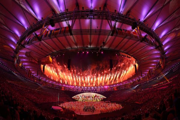 Fireworks explode over the stadium during the Opening