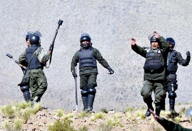 Riot policemen clash with miners in Panduro. Pic  AFP