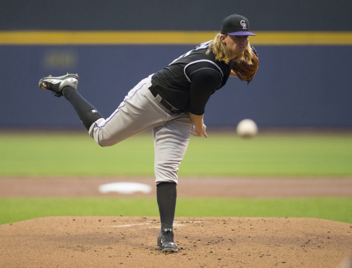 Carter homers, Nelson gets rare win as Brewers beat Rockies