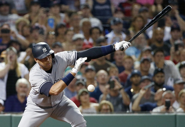 New York Yankees Alex Rodriguez grounds out to Boston Red Sox catcher Sandy Leon with the bases loaded allowing Brett Gardner to score during the eighth