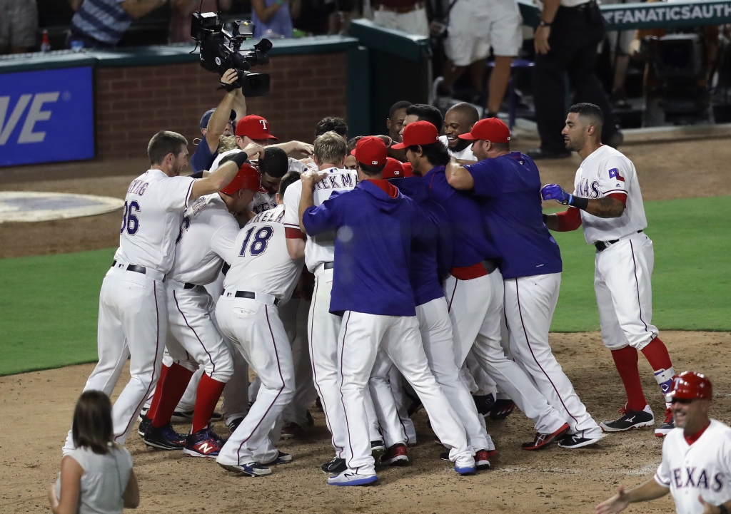 ARLINGTON TX- JULY 25 The Texas Rangers celebrate the two-run walk off homerun by Adrian Beltre #29 against the Oakland Athletics at Globe Life Park in Arlington