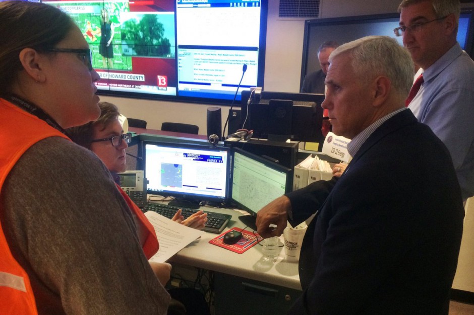 Gov. Mike Pence and Lt. Gov. Eric Holcomb received updates on the tornados and damage at the Emergency Operations Center Wednesday night