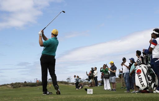 Marcus Fraser of Australia watches his tee shot on the 17th tee during the first round of the men's golf event at the 2016 Summer Olympics in Rio de Janeiro Brazil Thursday Aug. 11 2016