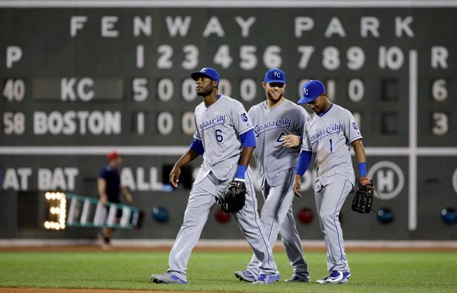 Kansas City Royals outfielders Lorenzo Cain, Alex Gordon and Jarrod Dyson walk to the dugout after they defeated the Boston Red Sox 6-3 in a baseball game at Fenway Park Friday Aug. 26 2016 in Boston