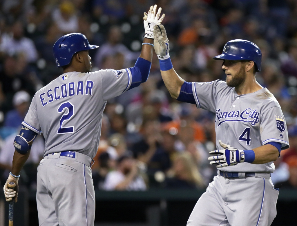 DETROIT MI- AUGUST 17 Alex Gordon #4 of the Kansas City Royals is congratulated by Alcides Escobar #2 of the Kansas City Royals after hitting a solo home run to tie the game against the Detroit Tigers at 1-1 in the eighth inning at Comerica Park on A