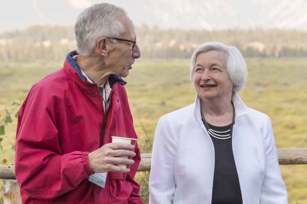 Stanley Fischer vice chairman of the U.S. Federal Reserve left and Janet Yellen chair of the U.S. Federal Reserve right speak outside of the Jackson Lake Lodge during the Jackson Hole economic symposium