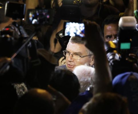 International Olympic Committee President Thomas Bach greets members