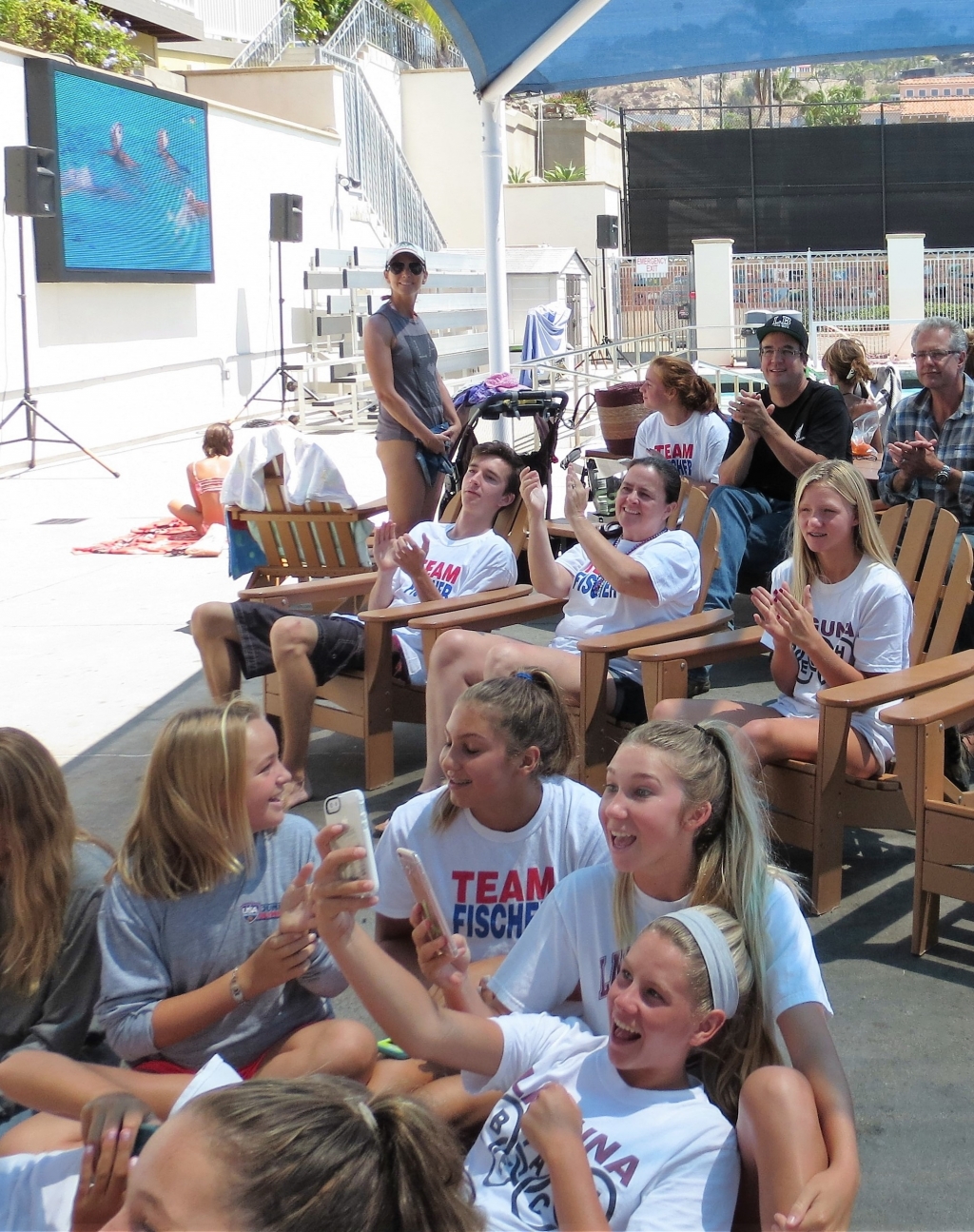 Team Fischer gathered at the high school pool to share the experience of watching two Laguna Beach girls on the US women's water polo team compete in the gold medal round in Brazil