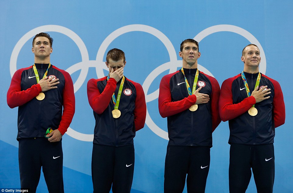 Ryan Held broke down in tears as he stood on the podium with Nathan Adrian, Michael Phelps, and Caeleb Dressell after winning gold in the Men's 4x100m Freestyle Relay