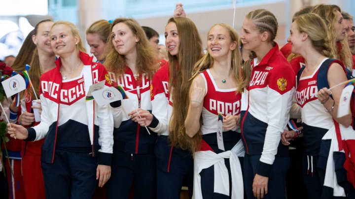 Russian Olympic team members prepare to depart for the Rio Games at Moscow's Sheremetyevo airport