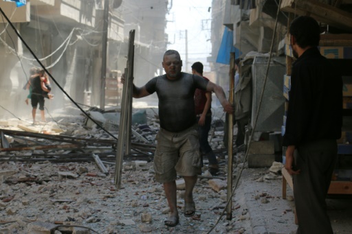 AFP  Ameer Alhalbi
A Syrian man makes his way through the rubble following a reported air strike on a rebel-held neighbourhood of Aleppo