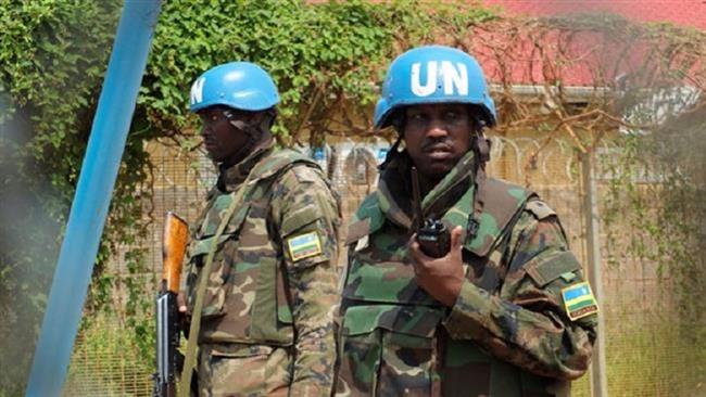 Rwandan peacekeepers serving in the United Nations Mission in South Sudan stand guard inside their compound in Juba