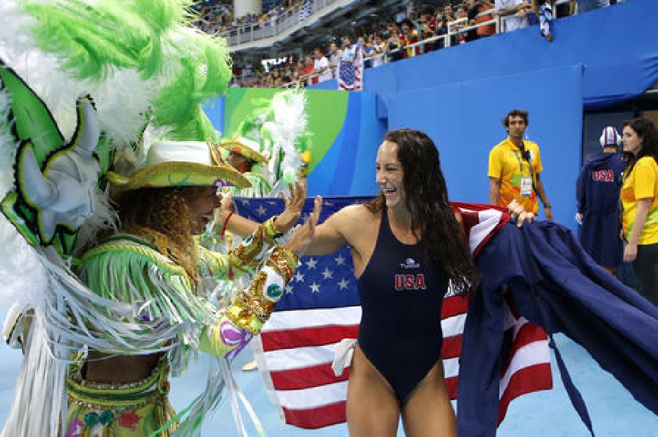 Maggie Steffens of women's water polo team celebrate after winning the gold medal match against Italy at the 2016 Summer Olympics in Rio de Janeiro Brazil Friday Aug. 19 2016