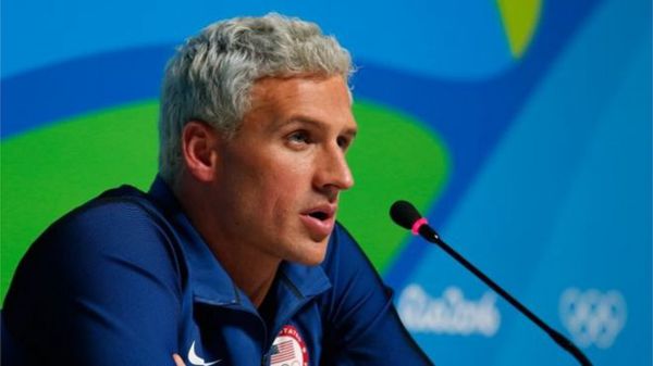 Ryan Lochte said a man robbed him at gunpoint while returning in a taxi to the Olympic village