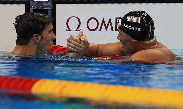 RIO DE JANEIRO BRAZIL- AUGUST 11 Michael Phelps of the United States shakes hands with Ryan Lochte of the United States after winning the Men's 200m Individual Medley Final on Day 6 of the Rio 2016 Olympic Games at the Olympic Aquatics Stadium