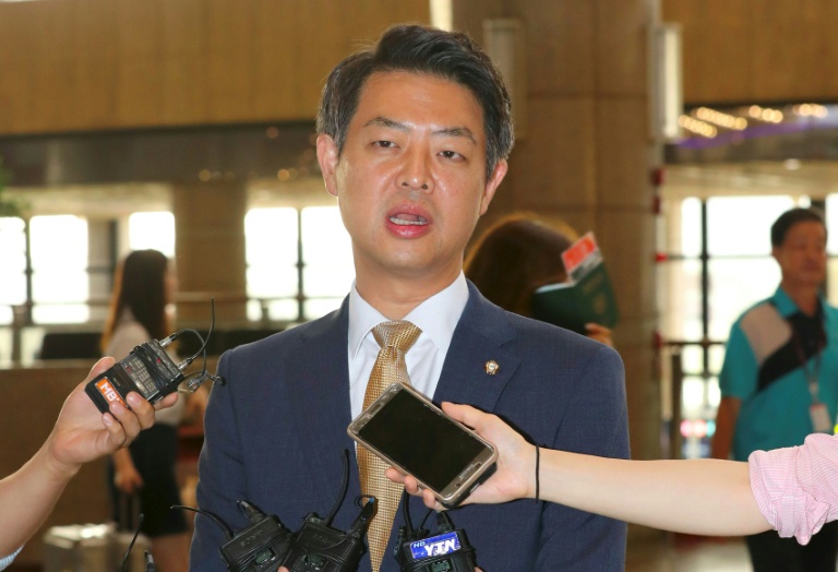 YONHAP  AFP  Kim Young-Ho a lawmaker from South Korea's main opposition Minjoo Party speaks to the media before departing for China at Gimpo airport in Seoul