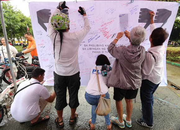 Thousand gather at the Lapu Lapu shrine in Luneta Manila to protest the planned interment of the ousted dictator Ferdinand E. Marcos in the Libingan ng mga Bayani in Taguig City