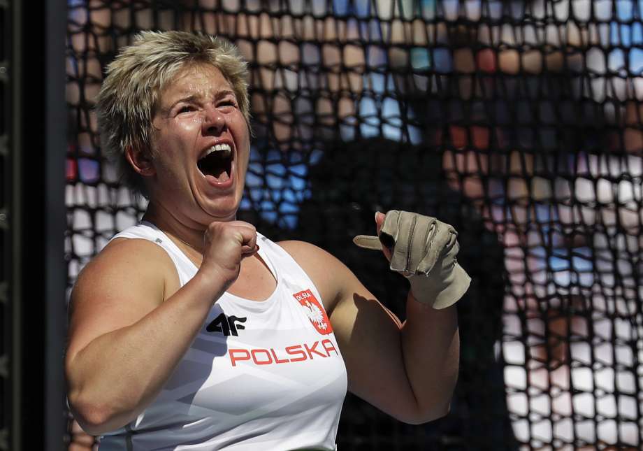 Poland's Anita Wlodarczyk screams after making her world record throw in the women's hammer throw final during the athletics competitions in the Olympic stadium of the 2016 Summer Olympics in Rio de Janeiro Brazil Monday Aug. 15 2016