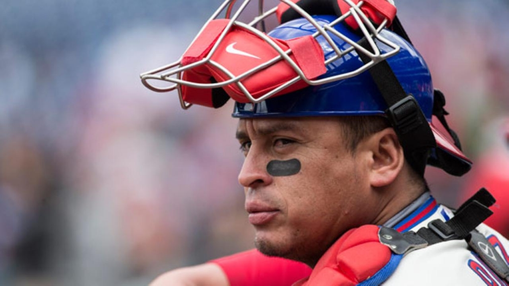 Philadelphia Phillies catcher Carlos Ruiz looks on during the first inning of a baseball game against the Cincinnati Reds Sunday