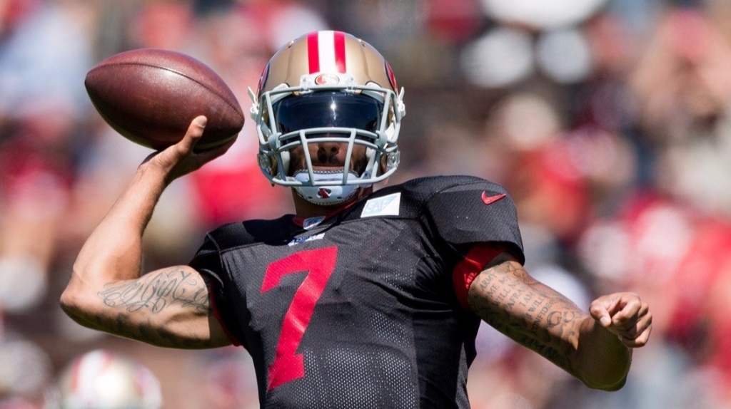 San Francisco 49ers quarterback Colin Kaepernick passes the ball during the training camp at Kezar Stadium