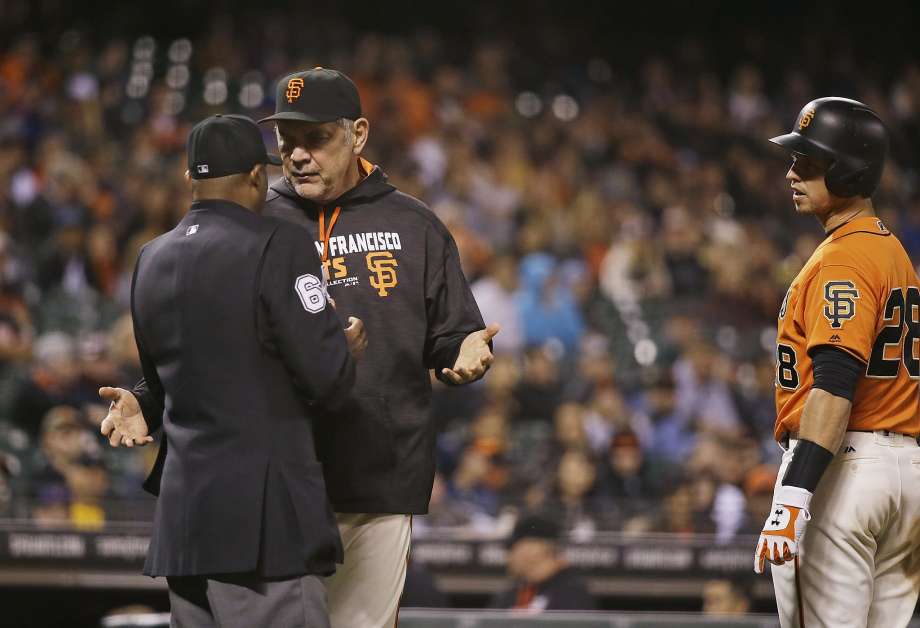 San Francisco Giants manager Bruce Bochy argues with home plate umpire Alan Porter after Giants Buster Posey right struck out swinging during the ninth inning of a baseball game against the Baltimore Orioles on Friday Aug. 12 2016 in San Francisco