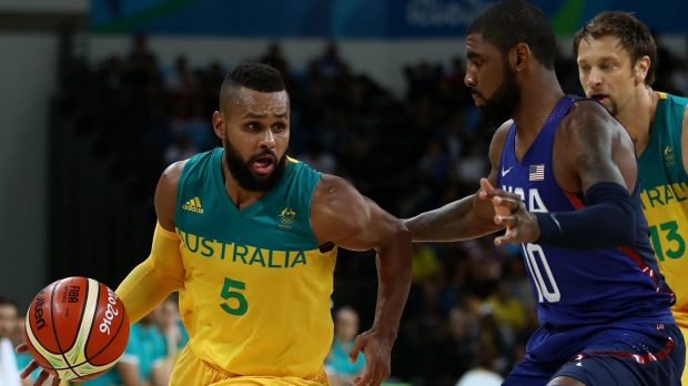 Scoring spree Boomers guard Patty Mills tries to get past American rival Kyrie Irving