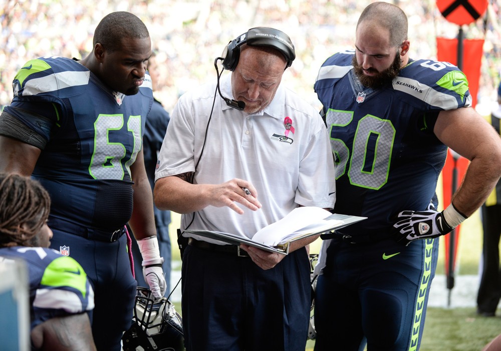 Century Link Field Seattle Washington Seattle Seahawks center Lemuel Jeanpierre and Seattle Seahawks center Max Unger look over play