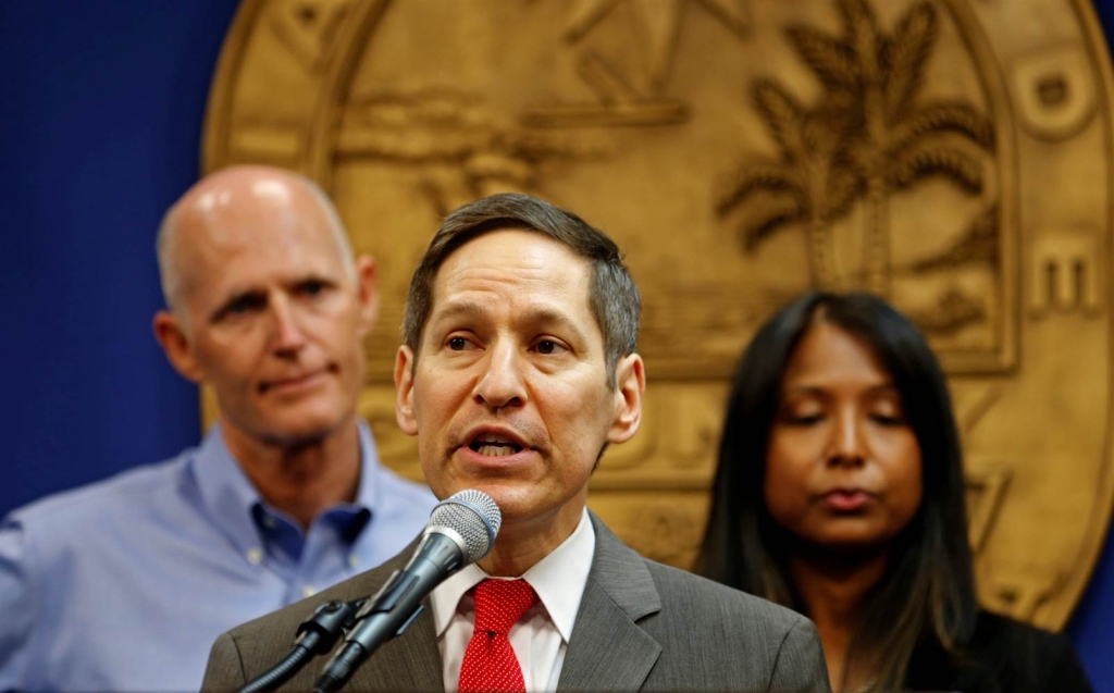 Image Dr. Tom Frieden Director of Centers for Disease Control and Prevention speaks as Florida Gov. Rick Scott and Florida Surgeon General Celeste Philip look on during a press conference on the Zika virus in Doral