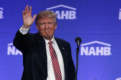 Republican presidential candidate Donald Trump waves after speaking to the National Association of Home Builders Thursday Aug. 11 2016 in Miami Beach Fla