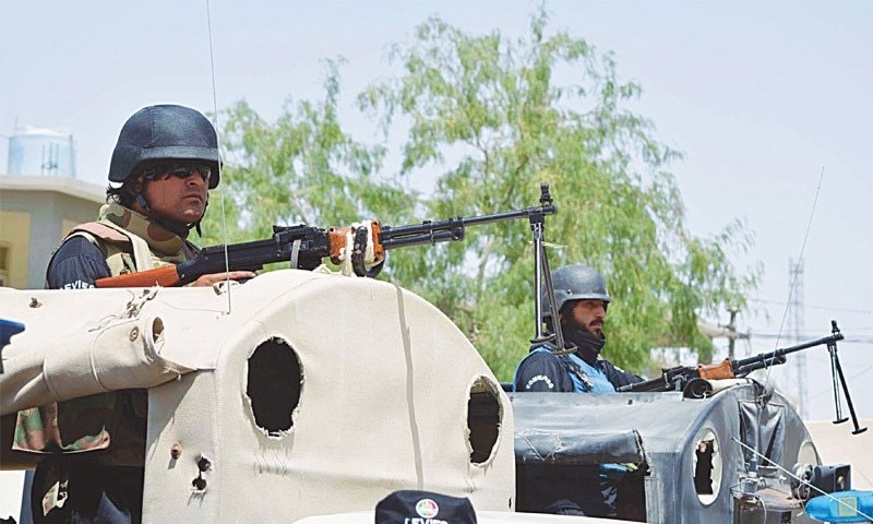 Security guards from the Quick Response Force on Friday stand alert in their vehicle at Chaman after the closure of the border gate.— INP