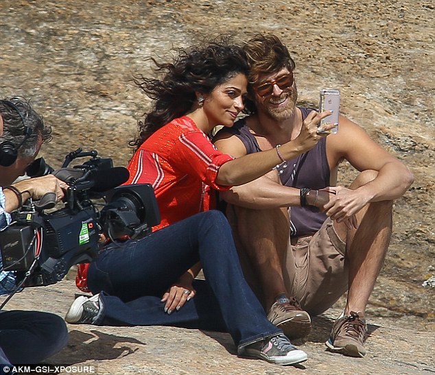 Selfie time! The model leaned in close to the dashing and smiling star