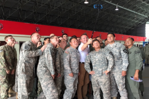 U.S Army Secretary Eric Fanning fourth from right takes a selfie with military personnel during an annual joint exercise with the Malaysian army in Johore Bahru Malaysia on July 30