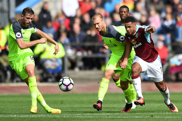 Burnley's Andre Gray right and Liverpool's Ragnar Klavan battle for the ball during their English Premier League soccer match at Turf Moor Burnley Englan