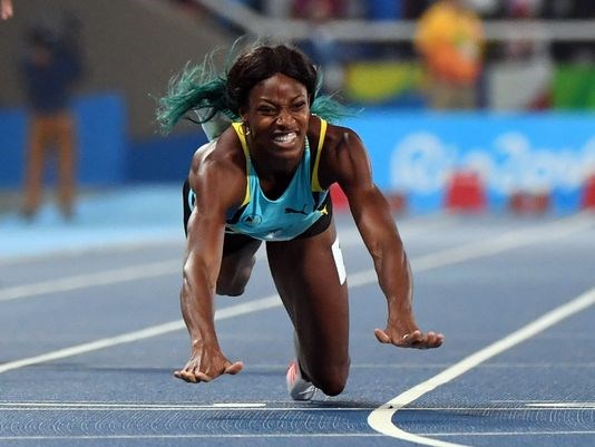 Shaunae Miller dove across the finish line to win the women's 400 meters